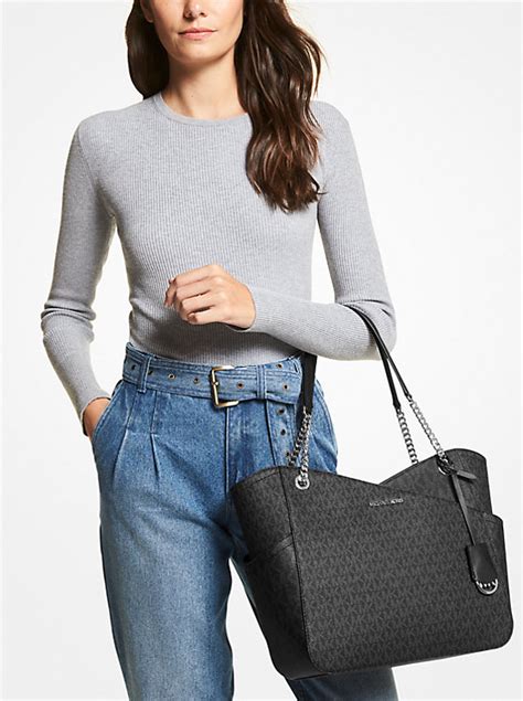 michael kors jet set travel shoulder bag|Michael Kors bag with airplanes.